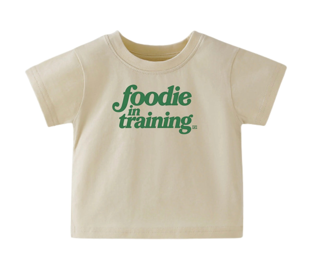 “foodie in training” Baby Cream T-Shirt